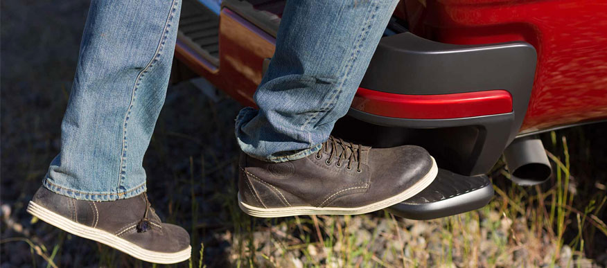 Recessed step in the rear bumper